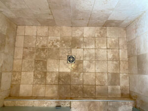 travertine shower floor before deep clean
